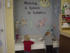 toddlers washing their hands