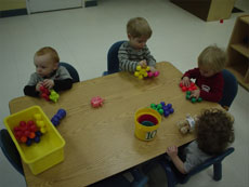 toddlers playing with blocks